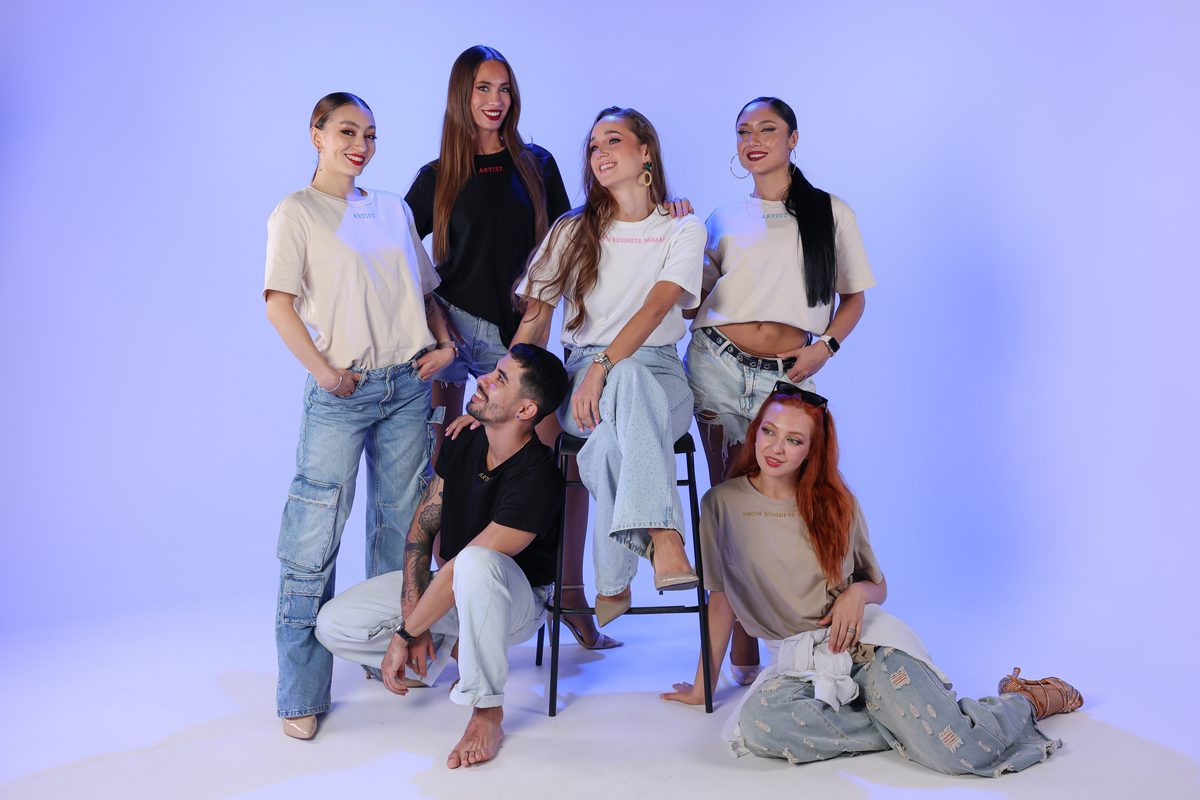 Dancers and team in casual wear posed together during a studio content day